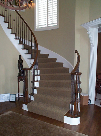Curved Staircase with Iron Spindles